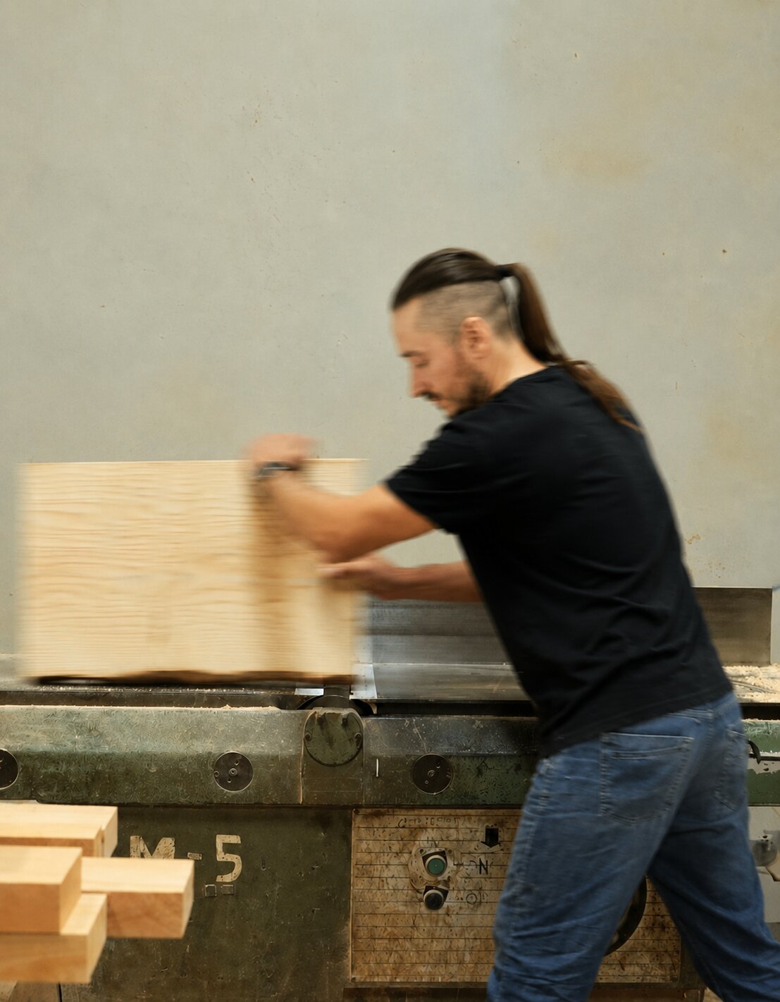 Woodworker preparing solid wood for a handmade guitar stand